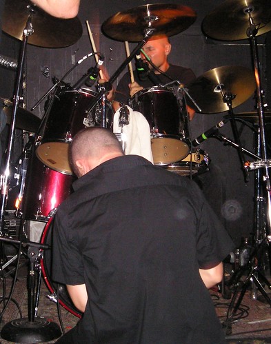 Marcelo sings into the bass drum
