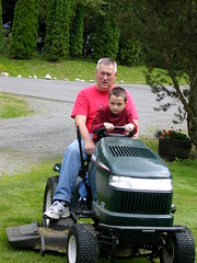 Ethan and Grampa Curt Mowing