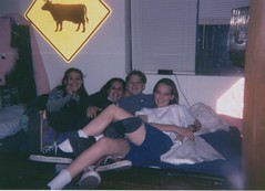 Bed covered with girls in grade 8